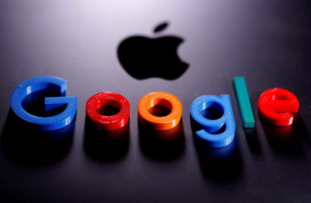 FILE PHOTO: A 3D printed Google logo is placed on the Apple Macbook in this illustration - MCG24 FR